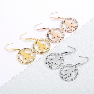 Three pairs of stainless steel hoop earrings with crystals and minimalist boy charm