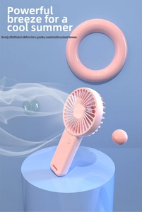 Detailed close-up of a pink portable mini fan with high-density blades on a pedestal