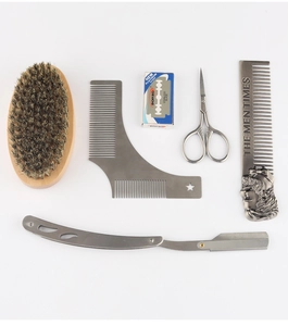 Flat lay of 6-piece men's beard grooming kit with brush, razor and metal styling comb