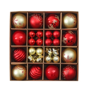 Detailed grid of assorted red and gold Christmas ball ornaments in a brown gift box