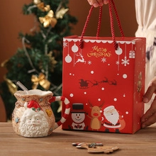 Christmas ceramic Santa mug with festive red gift bag and Merry Christmas typography