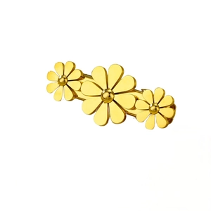 Golden stainless steel flower hair clip with zirconia petals on a clean white background