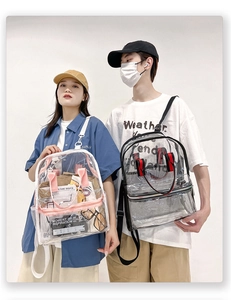 Models showing large capacity transparent PVC backpacks with pink and black trim detail