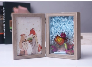 Detail of wooden shadow box frame with dried flowers and 4x6 inch illustration insert