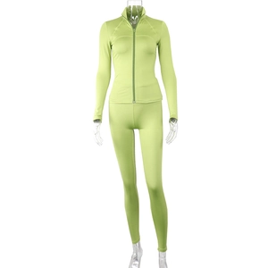 Detail of light green sports set featuring stand collar zipper jacket and leggings