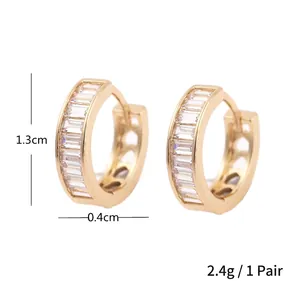 Minimalist gold hoop earrings with baguette cut zircons and 1.3cm outer diameter