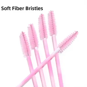 Detail of disposable eyelash brushes with soft fiber bristles and pink gradient handles