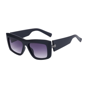 Fashionable matte black cat-eye sunglasses with purple gradient lenses and metal accents