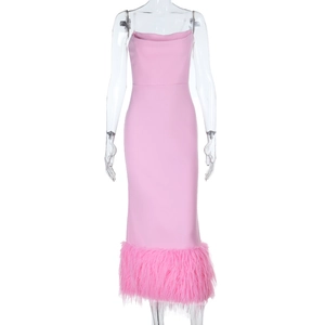 Detail of pink bodycon midi dress featuring elegant feather trim along the hemline