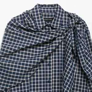 Blue and white plaid long sleeve shirt featuring a unique asymmetric front tie design