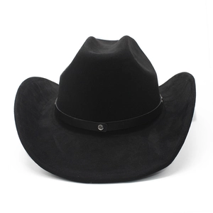 Detail of black suede cowboy hat featuring a vintage studded leather band and wide brim