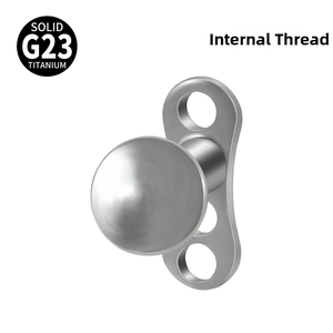 Macro view of solid G23 titanium dermal anchor with internal thread and teardrop dome head