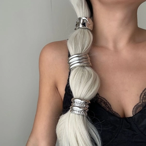 Minimalist silver metal hair ring set for elegant ponytails shown on a model