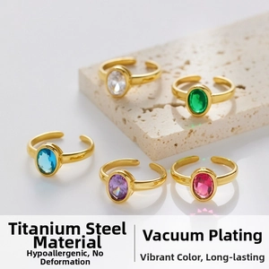 Detailed shot of gold plated stainless steel rings with colorful oval zircon gemstones