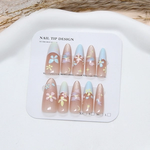 Handmade stiletto press-on nails with candy floral patterns and cat eye glitter finish