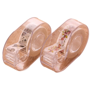 Two rolls of decorative washi tape with polar bear and floral prints and tape cutters