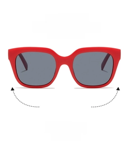 Detail showing oversized square pink sunglasses with light pink matte frame and grey lenses