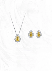 Detail of luxury S925 silver jewelry set featuring pear-cut yellow zircon pendants and halos