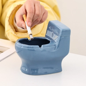 Creative blue toilet-shaped ceramic ashtray for desk with cigarette placement