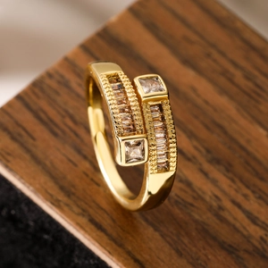 Macro detail of 18K gold plated ring featuring square zircons and geometric beads