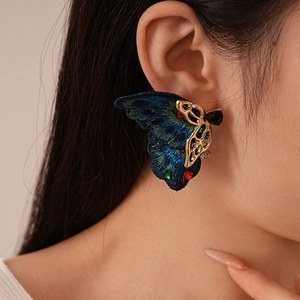 Boucles d'oreilles papillon vintage en broderie avec strass brillants et détails en métal