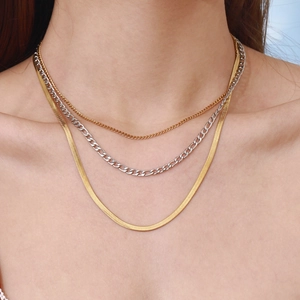 Three-layer layered necklace set with golden snake chain and silver Figaro chain links