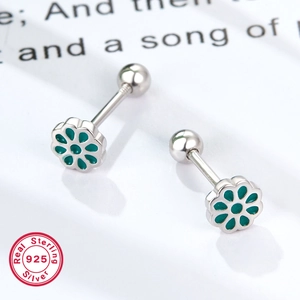 925 sterling silver flower stud earrings with green enamel petals on white background