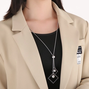 Silver geometric Y-shaped long necklace with hollow square frames and metallic beads