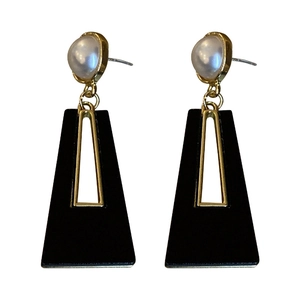 Exaggerated geometric acrylic earrings with gold-edged pearl and black trapezoid pendant