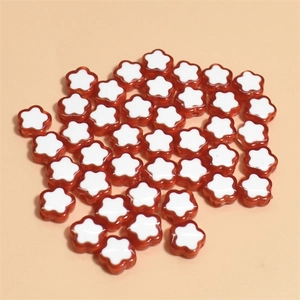 Macro shot of 10mm flower-shaped mixed color beads for DIY jewelry making and crafts
