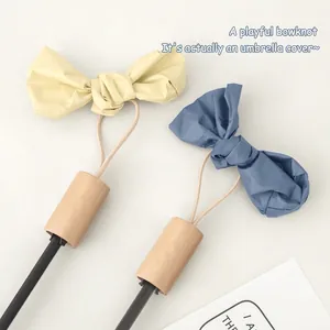 Three-fold sun umbrella with elegant bow covers in yellow and morandi blue tones