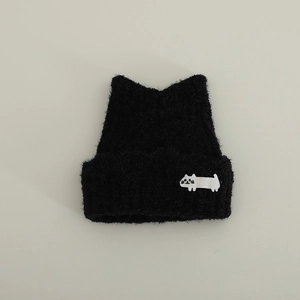 Close-up of black plush knit hat with cute cat ears and small white kitten embroidery