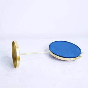 Nordic jewelry display stand with golden metal frame and royal blue velvet cushion tray
