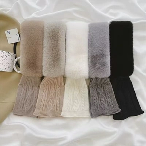 Detail of five winter scarves in various colors with plush faux fur and cable knit texture