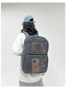 Detail view of the breathable grey mesh backpack showing spacious interior storage