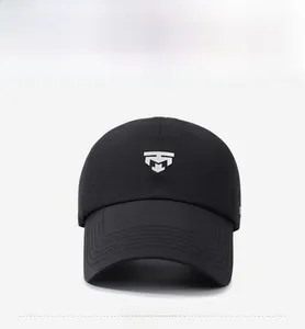 Detailed shot of a black baseball cap featuring white embroidered logo and curved brim