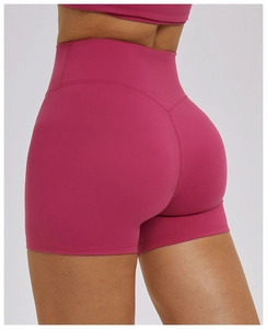 Close-up of high-waist yoga shorts in rose red with V-shaped stitching for butt lifting