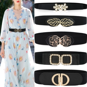 Women's black elastic waist belts with various gold metal buckles for elegant dress styling