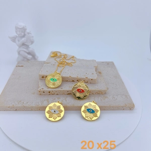 Macro view of gold-plated evil eye coin pendants with colorful enamel on stone stand