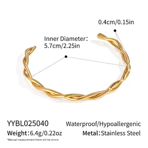 Macro view of 18K gold-plated twisted stainless steel bracelet showing 5.7cm diameter