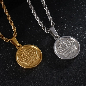 Detail of hip hop round crown pendants in gold and silver stainless steel twist chains
