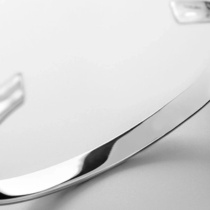 Macro shot of polished silver stainless steel bracelet featuring sleek minimalist design