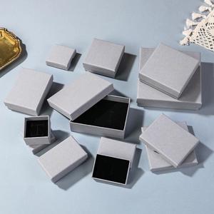 Elegant grey textured jewelry gift boxes with black velvet lining for rings and watches