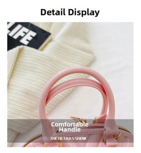 Detailed close-up of pink jelly handbag with gold metal hardware and comfortable handles