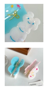 Detailed close-up of cute bear and butterfly hair clips with candy color finish