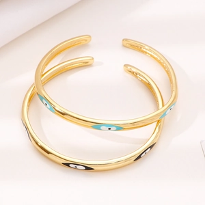 Eleganti bracciali rigidi a C placcati in oro con motivi occhio del diavolo in smalto