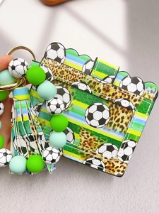 Detail of soccer pattern PU leather card holder with green silicone beaded tassel keychain