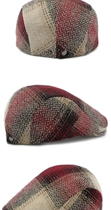 Detail view of herringbone and plaid pattern stitching on a wool blend beret hat