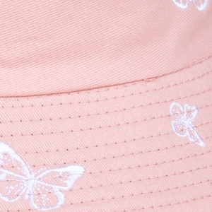 Pink cotton bucket hat featuring white butterfly embroidery and premium stitching detail