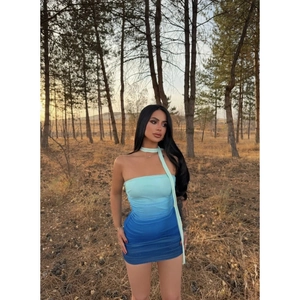 Detail of blue gradient tube mini dress with ruched fabric and matching long neck scarf